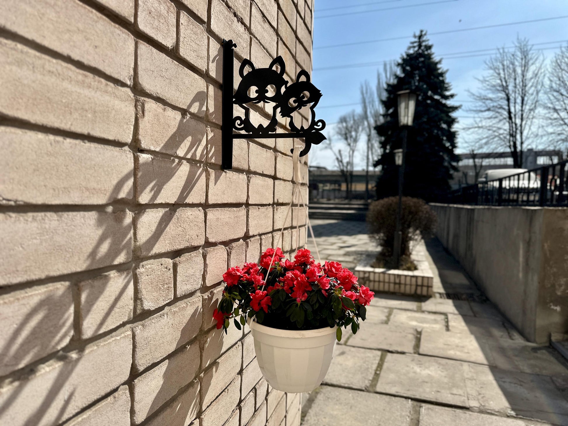 Raccoon friends metal outdoor plant hanger
